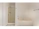 Bright bathroom featuring a soaking tub and glass-enclosed shower at 304 E Beth Dr, Phoenix, AZ 85042