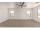 This carpeted bedroom features plenty of natural light and great neighborhood views at 304 E Beth Dr, Phoenix, AZ 85042