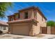 Side view of a well-maintained two-story home with a neutral color palette and tile roofing at 304 E Beth Dr, Phoenix, AZ 85042