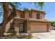 Charming two-story home with a neutral color palette, desert landscaping, and a tile roof at 304 E Beth Dr, Phoenix, AZ 85042
