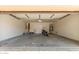 Spacious garage featuring concrete flooring, a motorcycle, and ample room for storage at 304 E Beth Dr, Phoenix, AZ 85042