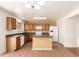 A roomy kitchen featuring a kitchen island and stainless steel appliances at 304 E Beth Dr, Phoenix, AZ 85042
