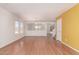 Spacious living room with hardwood floors, bright walls, and an open view to the backyard at 304 E Beth Dr, Phoenix, AZ 85042