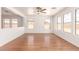 Bright and airy living room with hardwood floors and large windows providing ample natural light at 304 E Beth Dr, Phoenix, AZ 85042