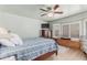 Cozy bedroom with bay window seat, shutter blinds, ceiling fan, and neutral paint at 3059 E Tyson Ct, Gilbert, AZ 85295
