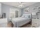 Bedroom with neutral walls, shuttered window, and a queen size bed at 3059 E Tyson Ct, Gilbert, AZ 85295