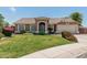 Charming single-story home featuring a well-maintained front yard and classic desert landscaping at 3059 E Tyson Ct, Gilbert, AZ 85295