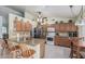 Spacious kitchen with a large island, wooden cabinets, and granite countertops at 3059 E Tyson Ct, Gilbert, AZ 85295