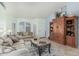 Comfortable living room featuring neutral walls, tile flooring, and a cozy seating arrangement at 3059 E Tyson Ct, Gilbert, AZ 85295