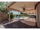 Covered patio overlooking the sparkling pool and spa is ideal for entertaining and outdoor living at 3059 E Tyson Ct, Gilbert, AZ 85295