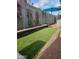 Lush backyard with vibrant bougainvillea and manicured turf at 3137 N 4Th Ave, Phoenix, AZ 85013