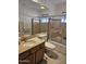 Well-lit bathroom featuring tiled shower, and granite vanity at 3137 N 4Th Ave, Phoenix, AZ 85013