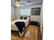 Neutral bedroom design with ceiling fan, hardwood floors, and a comfortable bed at 3137 N 4Th Ave, Phoenix, AZ 85013
