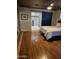 Bedroom with hardwood floors, barn door, and ensuite bathroom featuring dual-headed shower at 3137 N 4Th Ave, Phoenix, AZ 85013