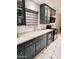 Charming kitchen with modern appliances, ample counter space, and stylish, green cabinets at 3137 N 4Th Ave, Phoenix, AZ 85013