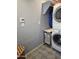 Functional laundry room featuring stacked washer and dryer units for space-saving convenience at 3137 N 4Th Ave, Phoenix, AZ 85013