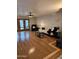 Elegant living room boasts gleaming hardwood floors and ample natural light from French doors, creating a bright atmosphere at 3137 N 4Th Ave, Phoenix, AZ 85013