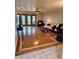 Spacious living room features gleaming hardwood floors and ample natural light from French doors, creating a cozy atmosphere at 3137 N 4Th Ave, Phoenix, AZ 85013