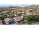 Expansive aerial view of a residential neighborhood with mountain views and backyard pools, highlighting community living at 3521 N Barron --, Mesa, AZ 85207