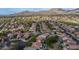 Scenic aerial shot of a suburban community showcasing lush landscaping, backyard pools, and mountain views at 3521 N Barron --, Mesa, AZ 85207