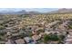 Breathtaking aerial view of a neighborhood with desert landscaping, pools, mountain views, and a marker indicating location at 3521 N Barron --, Mesa, AZ 85207