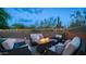 Cozy backyard patio with comfortable seating around a modern fire pit, perfect for outdoor relaxation at 3521 N Barron --, Mesa, AZ 85207