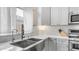 Bright and modern kitchen featuring stainless steel appliances and stylish fixtures at 3521 N Barron --, Mesa, AZ 85207