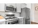 Modern kitchen with stainless steel appliances and ample cabinet space at 3521 N Barron --, Mesa, AZ 85207