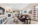 Bright living room with vaulted ceiling, fireplace, and sliding doors leading to the outdoor space at 3521 N Barron --, Mesa, AZ 85207