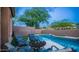 Backyard showcasing a refreshing pool, well-maintained artificial grass, and comfortable seating, ideal for outdoor enjoyment at 3521 N Barron --, Mesa, AZ 85207