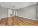 Open bedroom with hardwood floors and a ceiling fan at 3565 E Meadowview Dr, Gilbert, AZ 85298