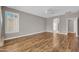 Open main bedroom featuring hardwood floors and a ceiling fan at 3565 E Meadowview Dr, Gilbert, AZ 85298