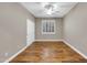Bedroom with wood floors, modern fan, and shutters offers a cozy retreat at 3565 E Meadowview Dr, Gilbert, AZ 85298