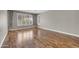 Spacious bedroom with wood floors, plantation shutters, and neutral paint colors offers a serene retreat at 3565 E Meadowview Dr, Gilbert, AZ 85298