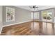 Spacious empty room featuring wood floors and sliding glass door to the patio at 3565 E Meadowview Dr, Gilbert, AZ 85298