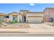 Charming single-story home with desert landscaping, a two-car garage, and a welcoming entryway at 3565 E Meadowview Dr, Gilbert, AZ 85298