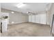 Spacious garage with painted concrete floor, and an insulated garage door at 3565 E Meadowview Dr, Gilbert, AZ 85298