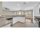 Open kitchen featuring granite countertops, white cabinets, and stainless steel appliances at 3565 E Meadowview Dr, Gilbert, AZ 85298