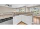 Bright kitchen featuring granite countertops, white cabinets, and stainless steel appliances at 3565 E Meadowview Dr, Gilbert, AZ 85298