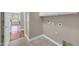 Laundry room features tile floors, white cabinets, and convenient utility hookups at 3565 E Meadowview Dr, Gilbert, AZ 85298