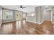 Open living area featuring hardwood floors and natural light from the sliding glass door and windows at 3565 E Meadowview Dr, Gilbert, AZ 85298