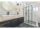 Bathroom with double vanity, sleek fixtures, and a glass-enclosed shower featuring marble tile at 4024 E Hiddenview Dr, Phoenix, AZ 85048