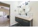 Bathroom with double sinks, modern fixtures, and a decorative floating cabinet at 4024 E Hiddenview Dr, Phoenix, AZ 85048