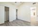 Bedroom with wood-look flooring, closet, and a neutral color scheme at 4024 E Hiddenview Dr, Phoenix, AZ 85048