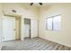 Bedroom featuring wood-look floors, a closet, and a window at 4024 E Hiddenview Dr, Phoenix, AZ 85048