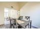 Dining room with wood table, chairs, and view into the home's entryway at 4024 E Hiddenview Dr, Phoenix, AZ 85048