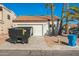 Exterior showcasing a two-car garage and desert landscaping in the front yard at 4024 E Hiddenview Dr, Phoenix, AZ 85048