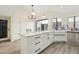 Bright kitchen featuring white cabinetry, marble countertops, stainless steel appliances, and a breakfast nook at 4024 E Hiddenview Dr, Phoenix, AZ 85048