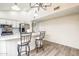 Bright kitchen with an island, barstool seating, and stainless steel appliances at 4024 E Hiddenview Dr, Phoenix, AZ 85048