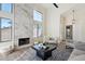 Bright living room with marble fireplace, high ceilings, and modern decor at 4024 E Hiddenview Dr, Phoenix, AZ 85048